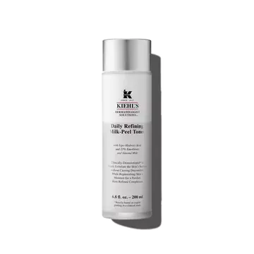 A graphic featuring a frosted bottle of Kiehl's Daily Refining Milk-Peel Toner with a silver cap and a label with black text. 