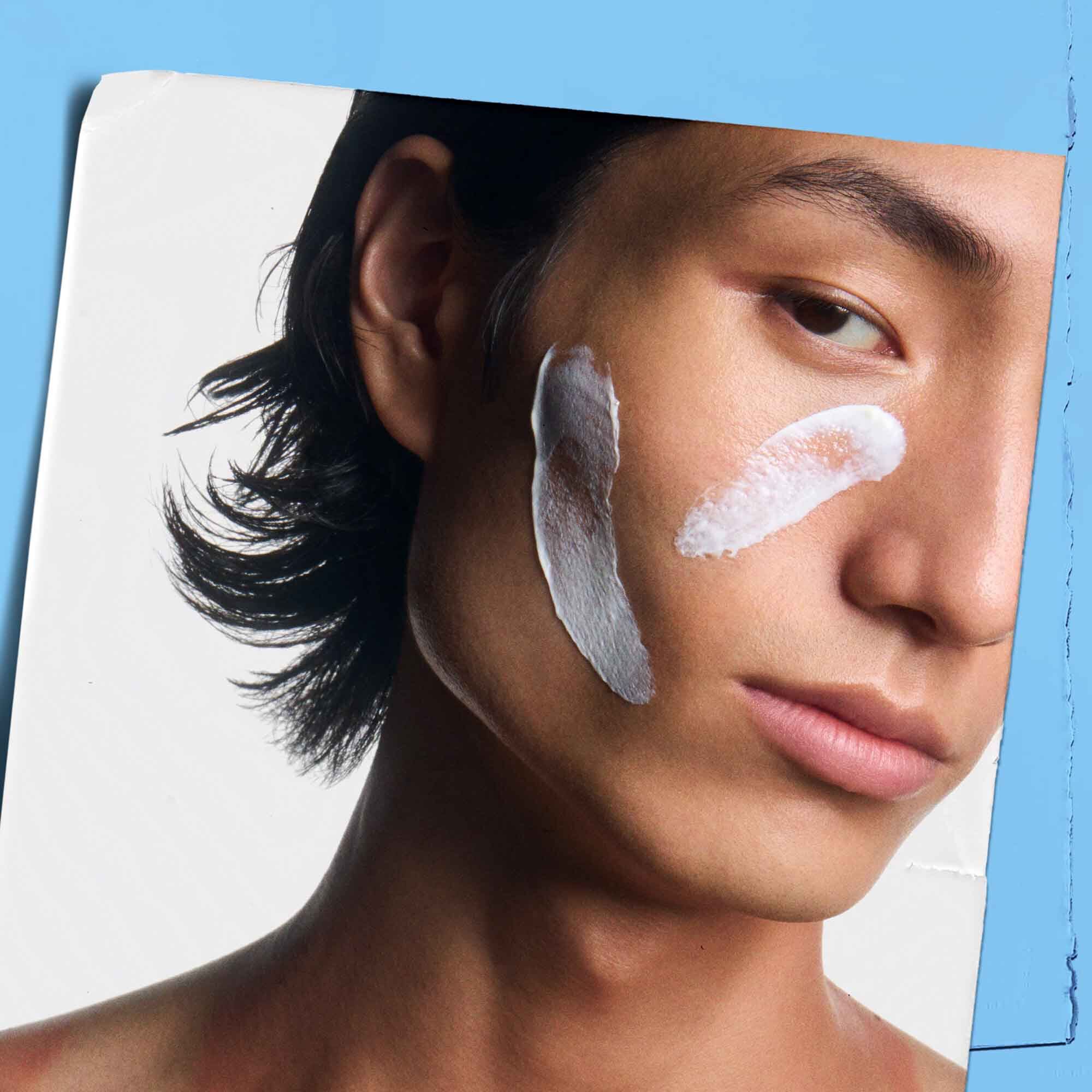 Ultra Facial Cream SPF 30 swiped on a model's face.