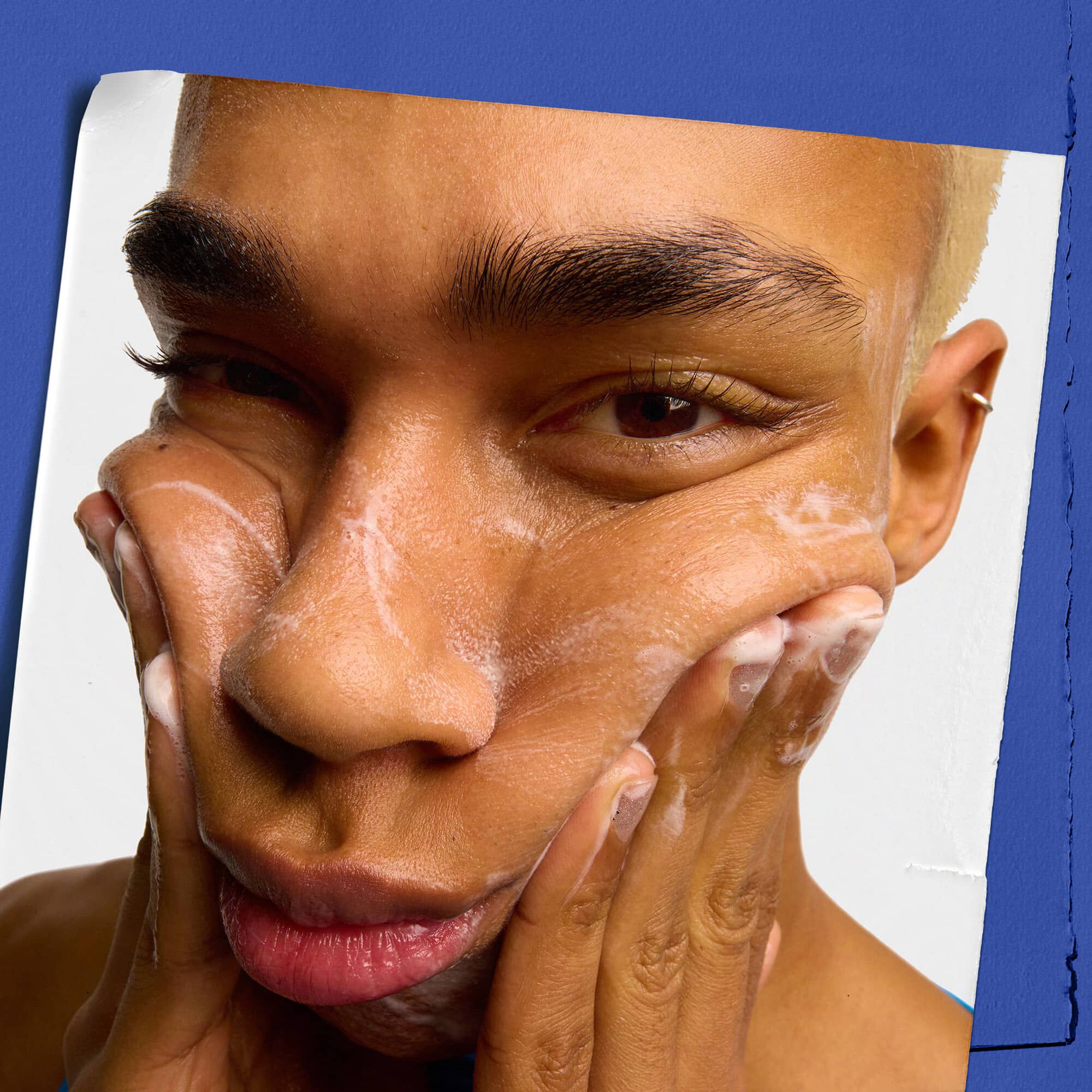 Model using Kiehl's Facial Fuel Energizing Face Wash facial cleanser for men