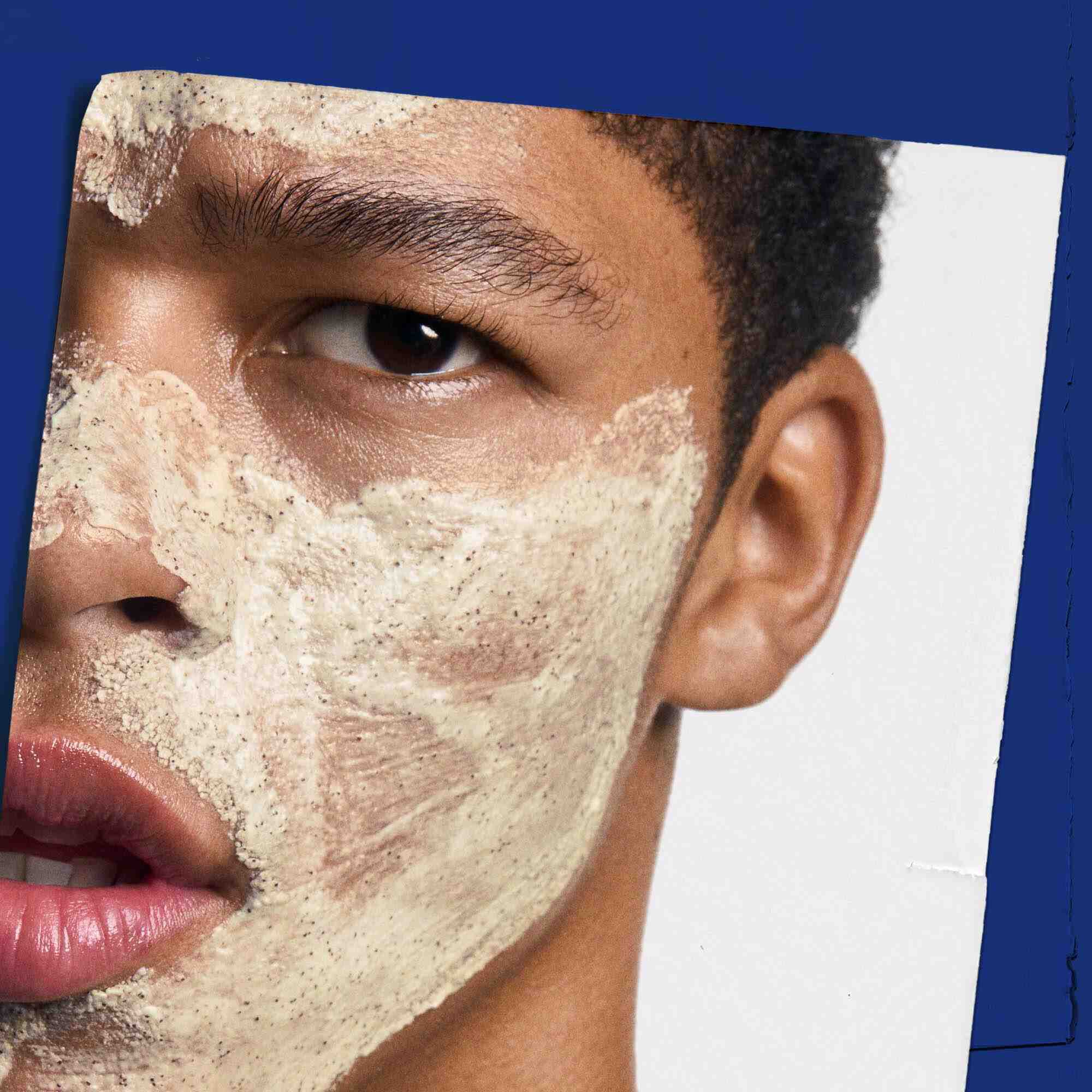 Facial Fuel Energizing Scrub applied to a person's face, demonstrating its use.