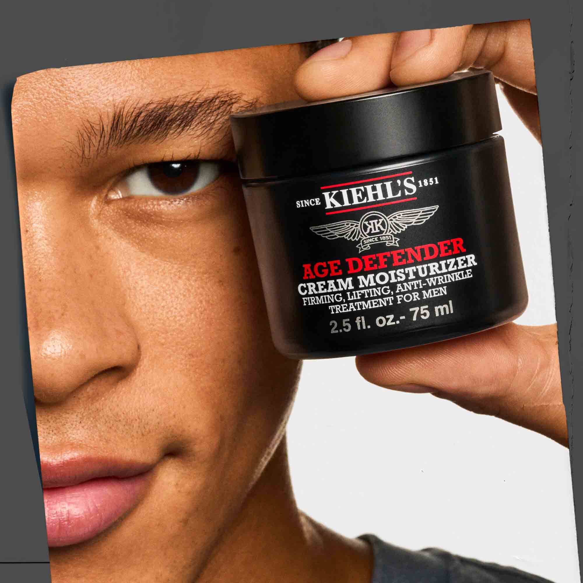 Age Defender Cream Moisturizer being held, showcasing its portability and ease of use.