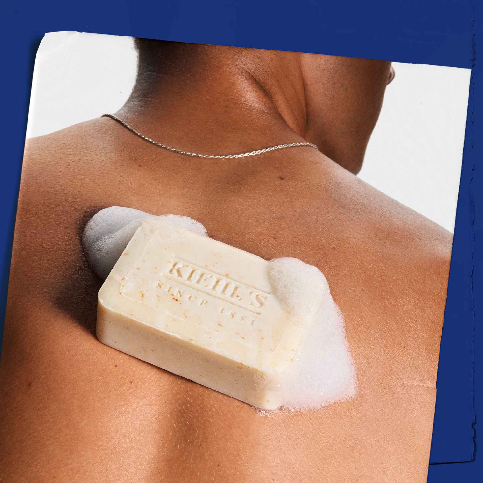 Ultimate Man Body Scrub Soap being used on skin, showing its application and lather.