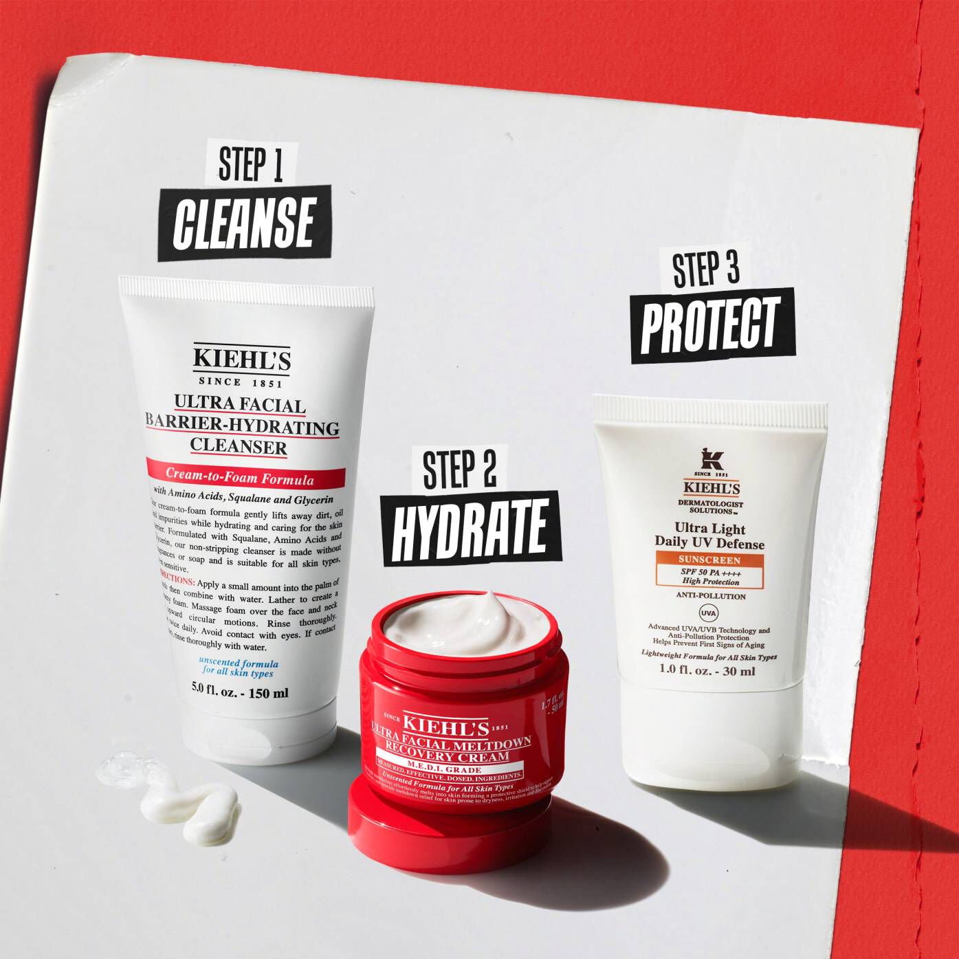 Three Kiehl’s products: Step 1 Cleanse (Barrier-Hydrating Cleanser), Step 2 Recover (Meltdown Recovery Cream), and Step 3 Protect (Better Screen UV Serum).