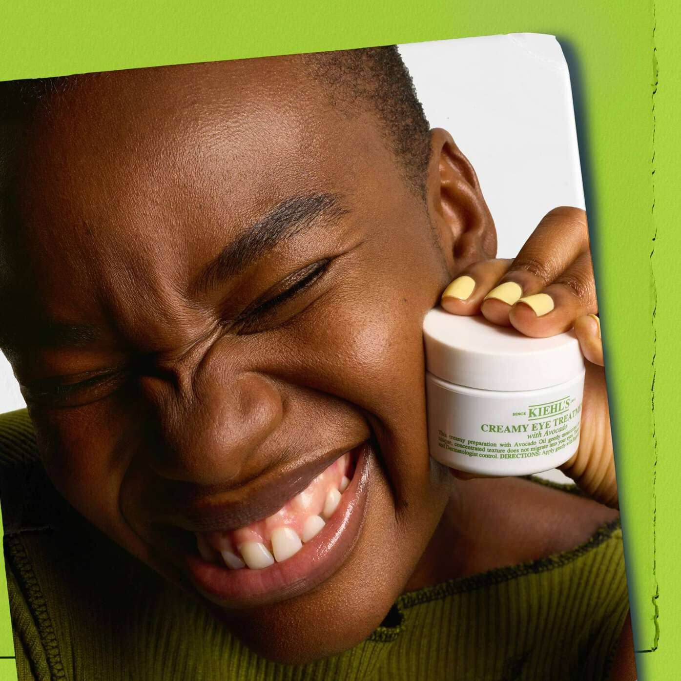 Model holding jar of Kiehl's Creamy Eye Treatment with Avocado