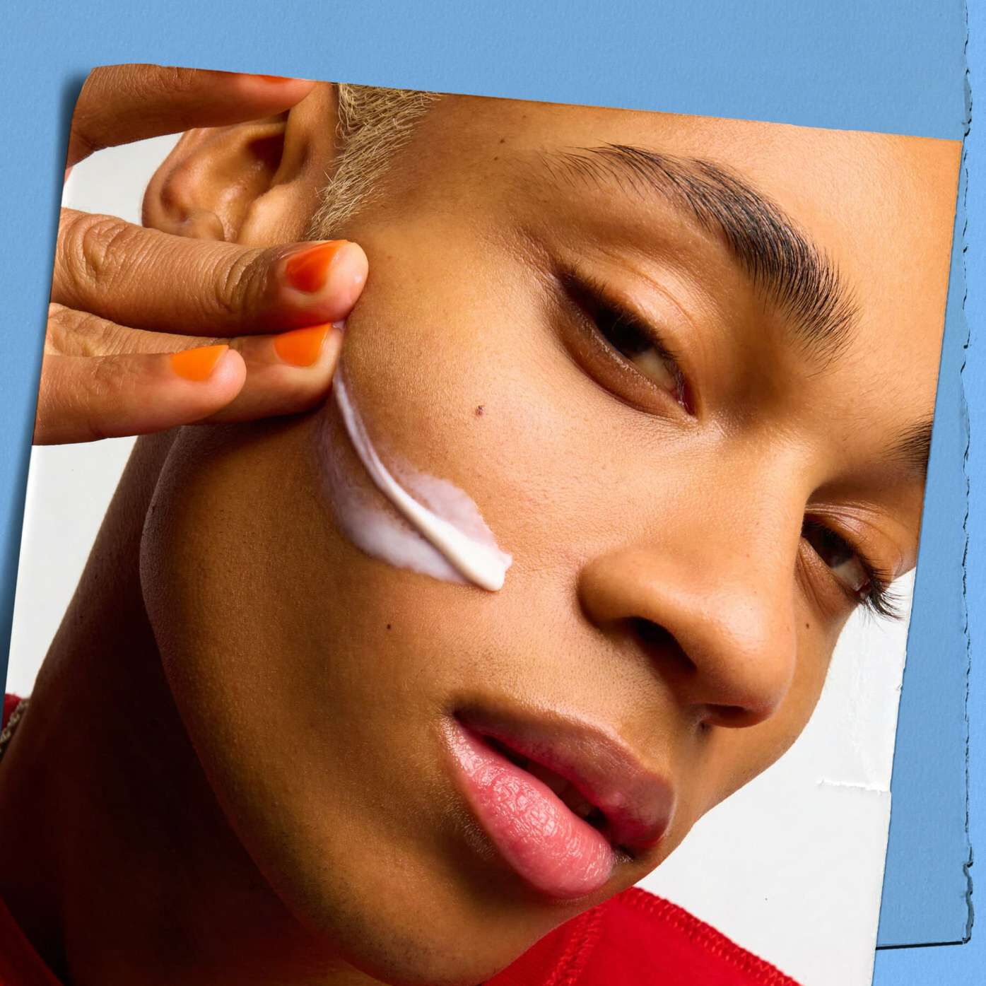 Model with a texture sample of Kiehl's Ultra Facial Moisturizer on their face