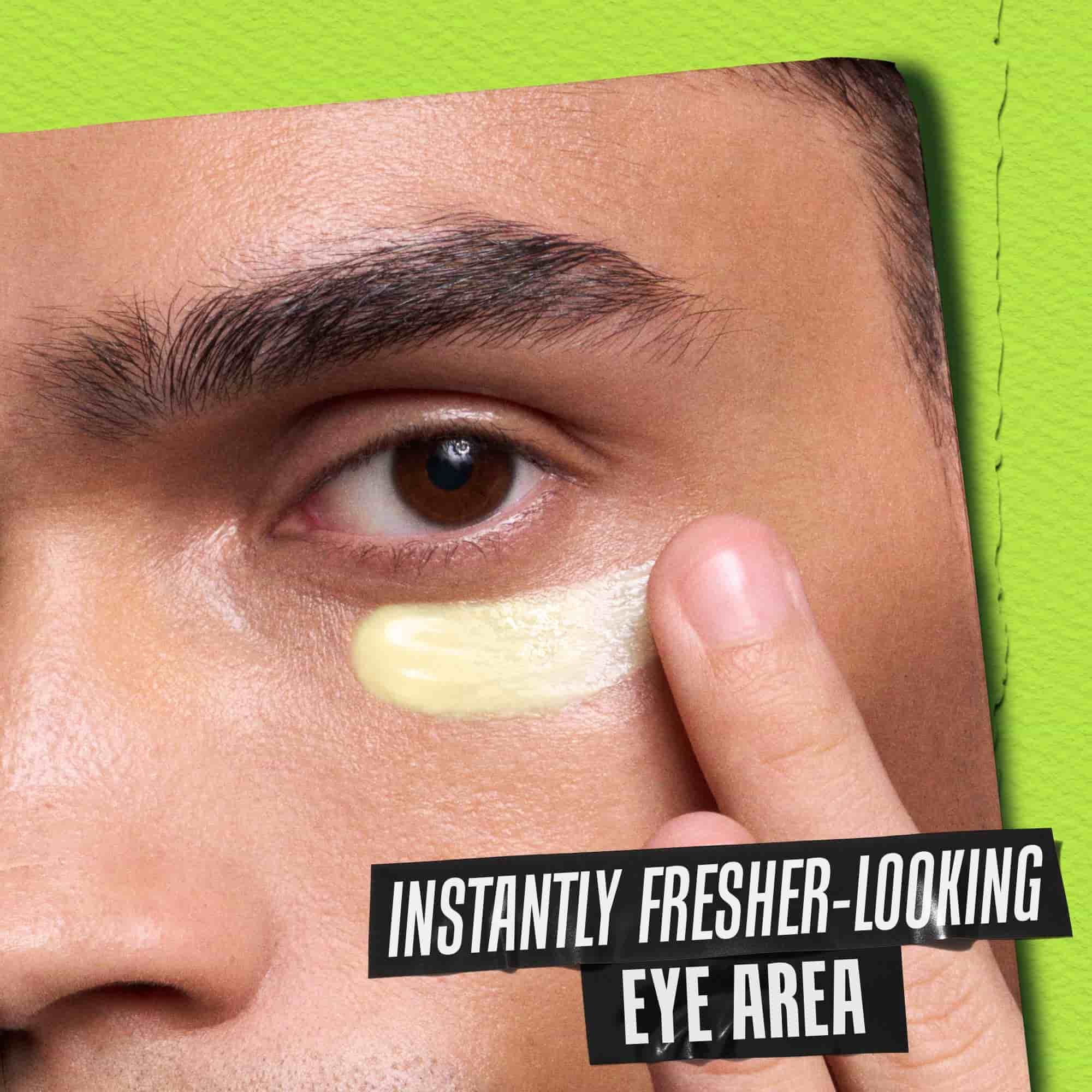 Model holding jar of Kiehl's Creamy Eye Treatment with Avocado