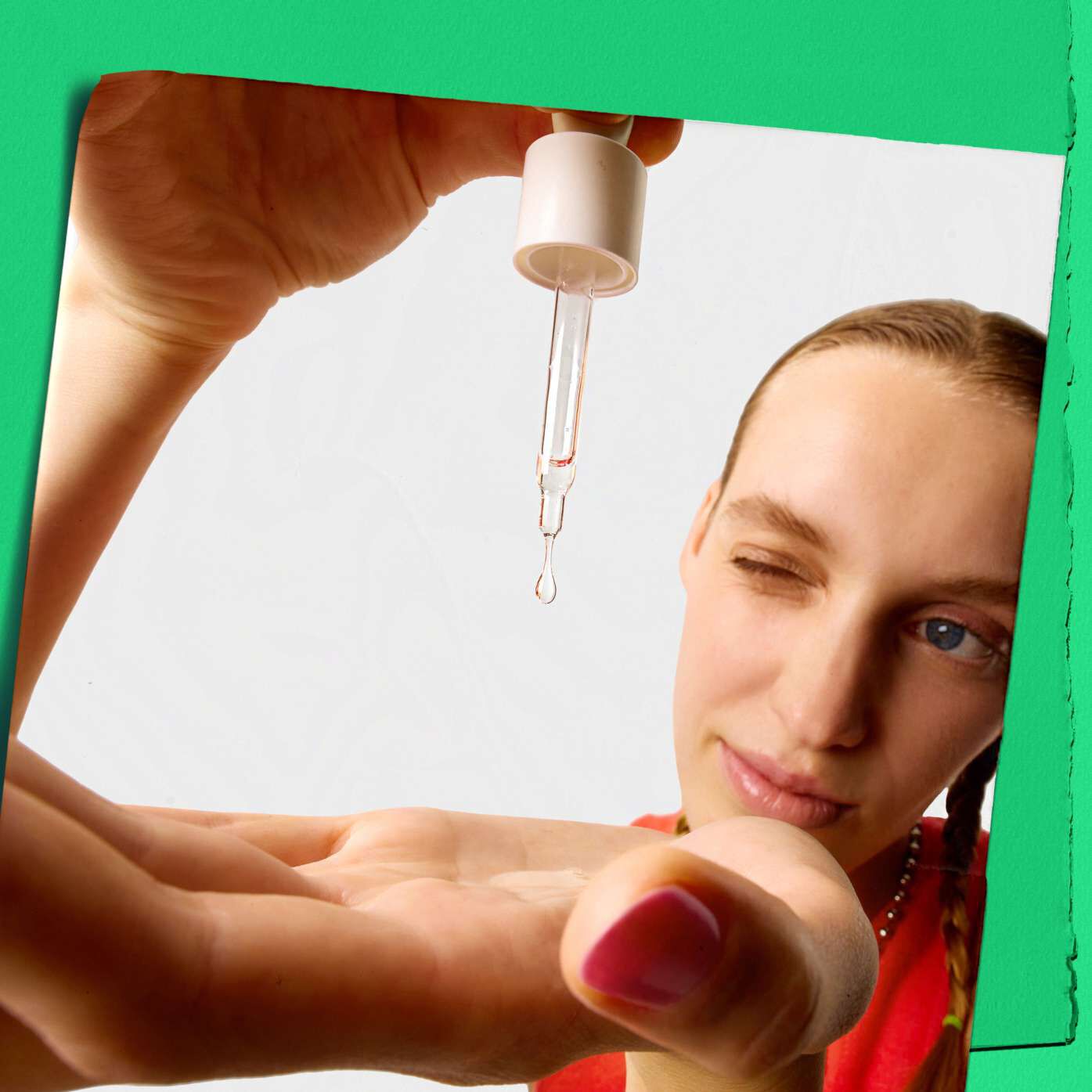 Model dropping Kiehl's Ultra Pure High-Potency Serum on their hand