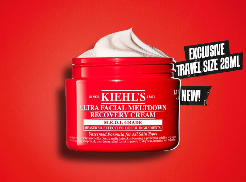Red jar of Kiehl's Ultra Facial Meltdown Recovery Cream against a red background. Text on right reads "Exclusive Travel Size 28ml. New!" Cream is visible.
