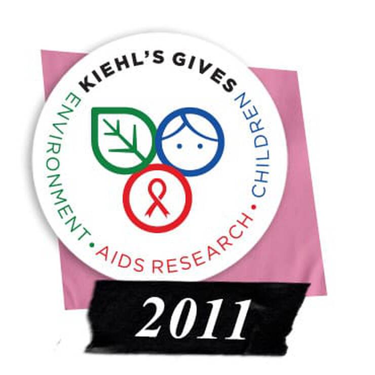 Kiehl's Gives logo featuring symbols for environment, AIDS research, and children, with the year 2011 emphasized below.