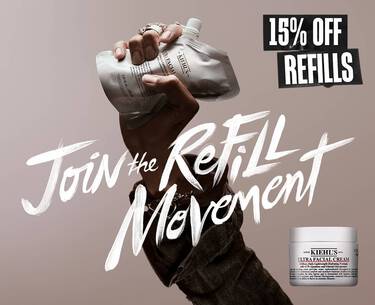 Promo banner reading "Join the Refill Movement" in white brush strokes next to "15% OFF REFILLS". Features a hand holding a Kiehl’s Ultra Facial Cream refill pouch and a standard product jar on a beige background.