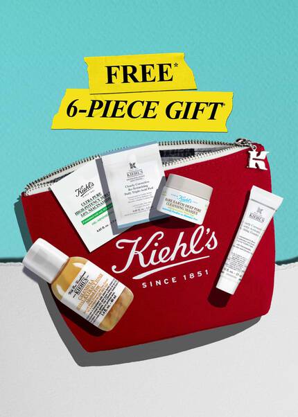 Promotional image featuring a Kiehl's branded pouch filled with skincare products, Calendula Toner 40ml Rare Earth Masque 14ml UV Defence Aqua Gel 3ml Niacinamide serum 1.5ml Clearly Corrective Emulsion 15ml Canvas Pouch on a white and blue background.