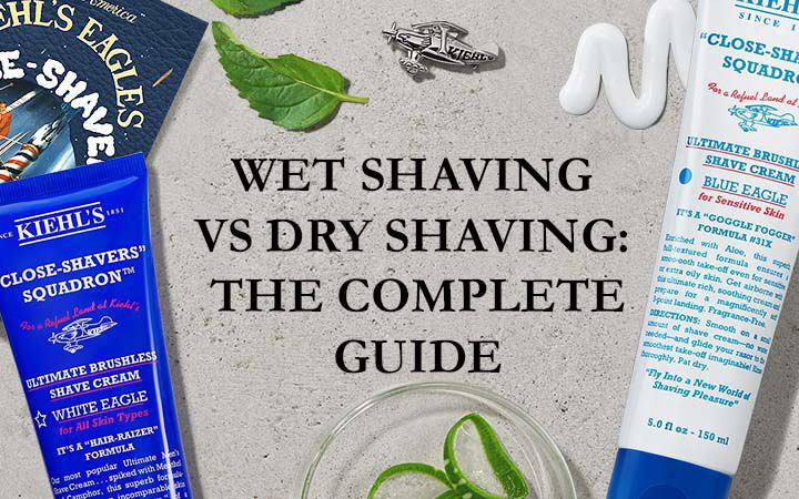 Image featuring various shaving products arranged aesthetically, with a title in the center reading "Wet Shaving vs Dry Shaving: The Complete Guide." The products include tubes of shaving cream and a razor, alongside natural elements like mint leaves.