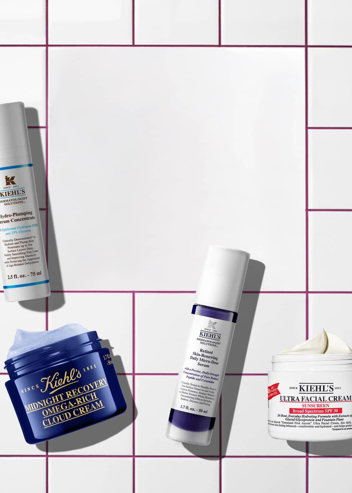 White tiled banner with pink grout lines displaying four Kiehl's products: Hydro-Plumping Serum, Midnight Recovery Cloud Cream, Retinol Micro-Dose Serum, and Ultra Facial Cream SPF 30.