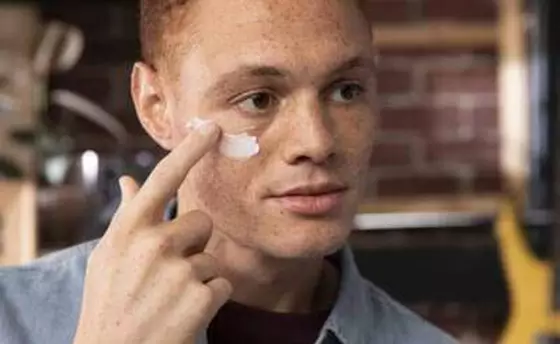 Man applying sun cream