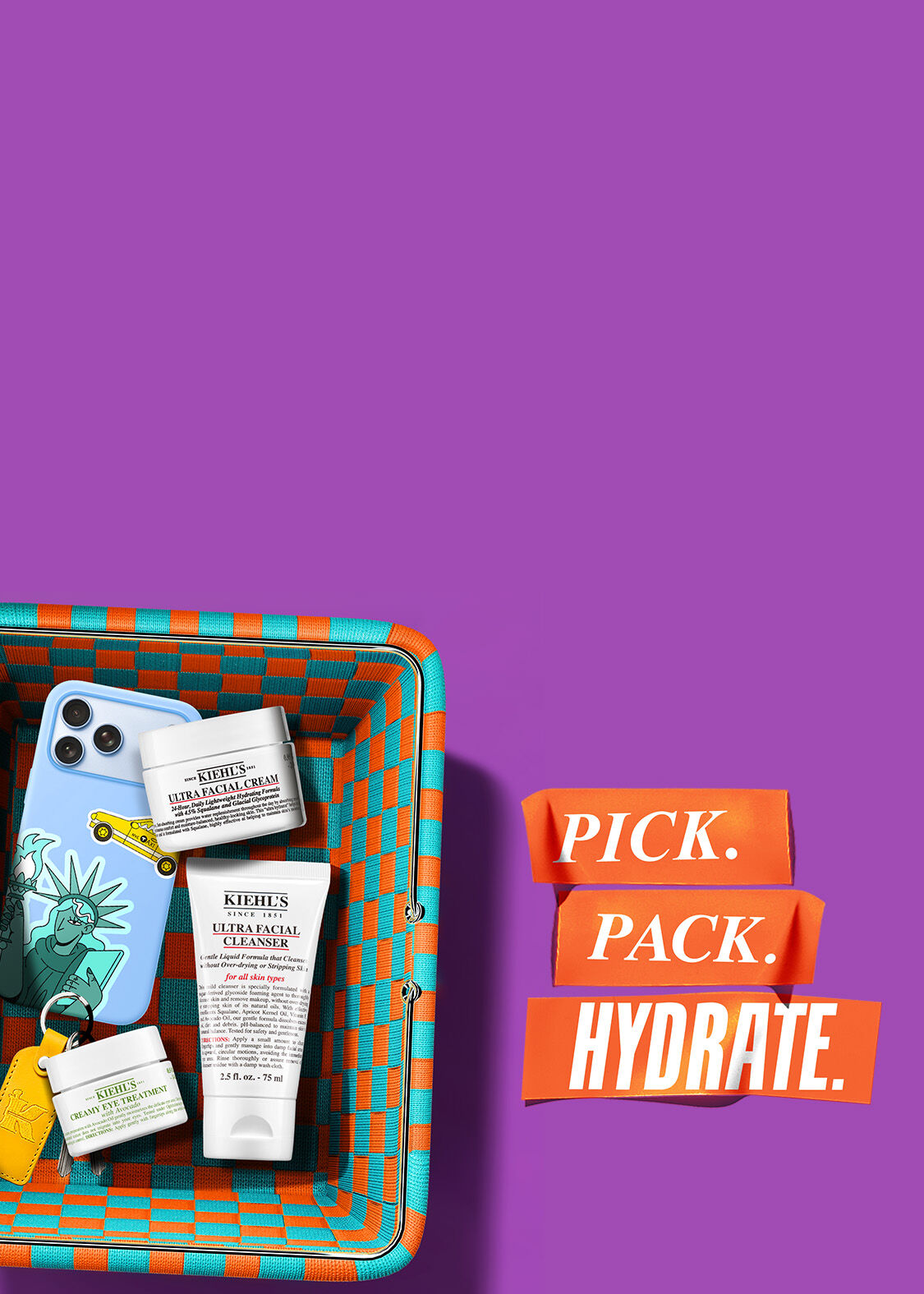 Purple banner with a colorful woven basket containing travel-sized Kiehl's products: Ultra Facial Cream, Cleanser, and Avocado Eye Treatment. Text reads "BANK HOLIDAY PREP? SORTED. 3 FOR 2 ON TRAVEL MINIS*."