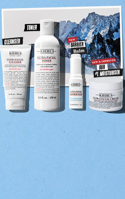 Image features Kiehl's skincare products on a blue background, including a cleanser, toner, moisturizer, and barrier balm, with text highlighting "New & Improved." There are images of mountains in the background.