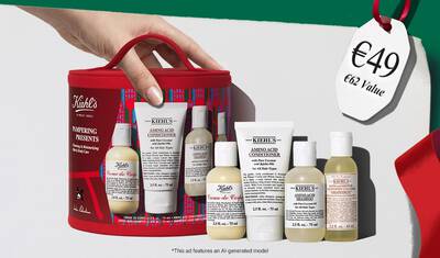 Hydrating Holiday Hits" skincare gift set on a green background, featuring Ultra Facial Cream and Creamy Eye Treatment with Avocado in festive packaging.​