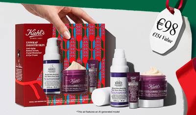 Hydrating Holiday Hits" skincare gift set on a green background, featuring Ultra Facial Cream and Creamy Eye Treatment with Avocado in festive packaging.​
